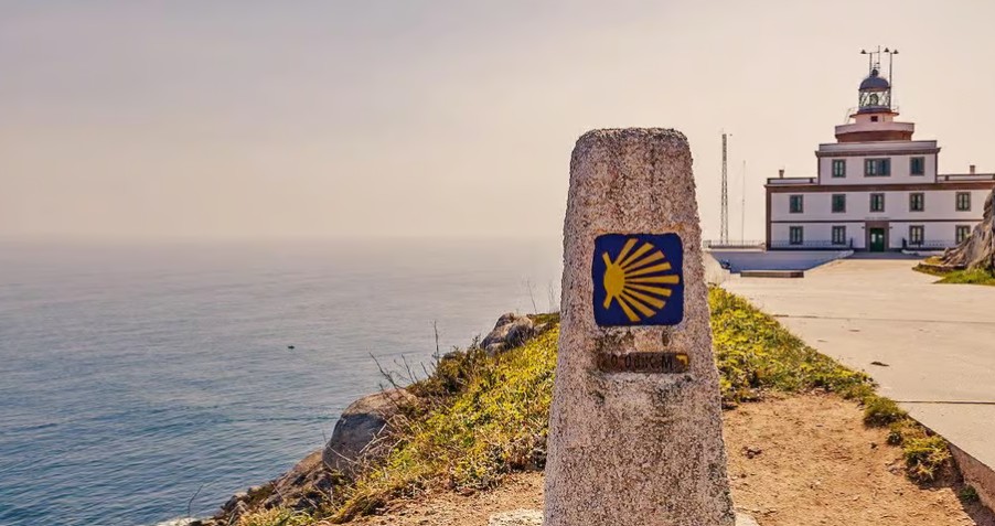 Finisterre lighthouse and Camino shell marker